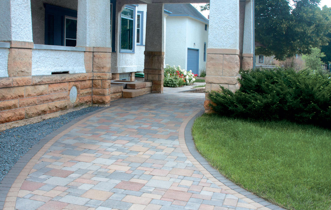 Cobblestone pavers in multi-colors for carport driveway. 