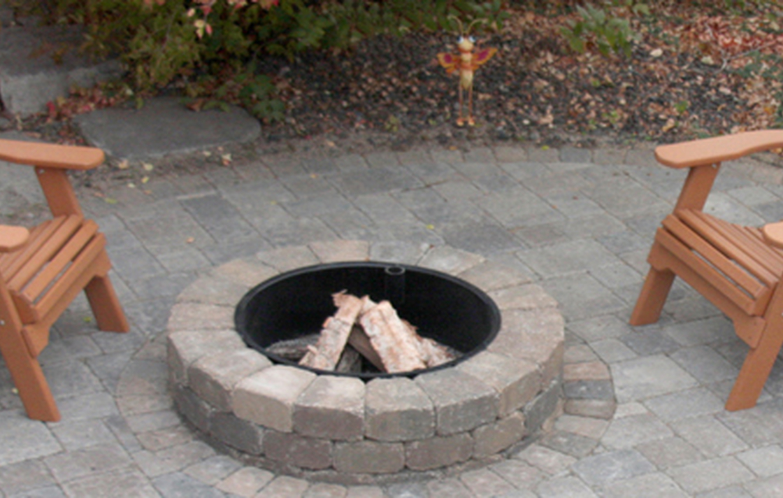 Enjoy a cozy fire ring on your new paver patio.